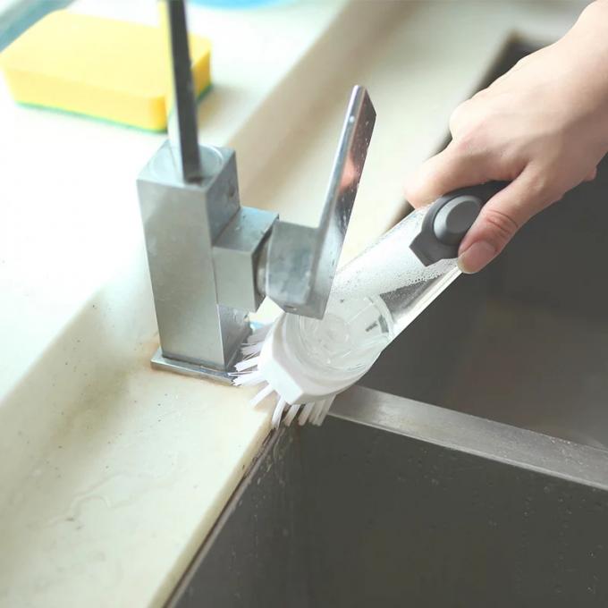 Χέρι κουζινών - κρατημένη πιάτων πλύσης δοχείων βουρτσών αυτόματη σαπουνιών διανομής πιάτων καθαρή βούρτσα λαβών βουρτσών μακριά
